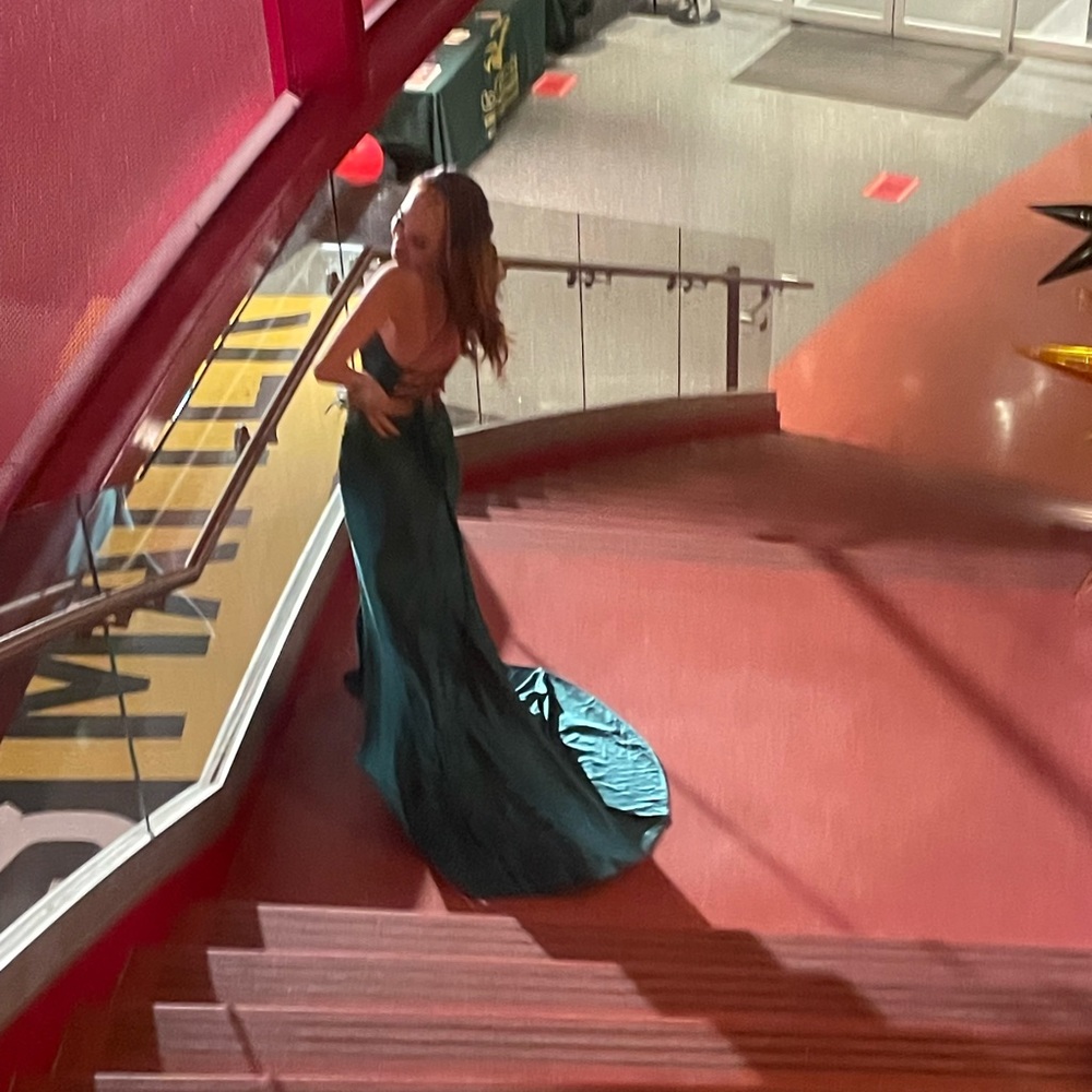 green prom dress,size 00, small rip in the seam but not very noticeable paid 360